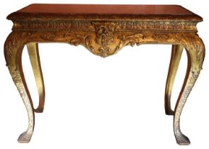 A GOOD PAIR OF GEORGE I STYLE CARVED GILTWOOD MARBLE TOP SIDE TABLES with marble top inset tops upon