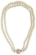 A DOUBLE STRAND PEARL NECKLACE WITH A CIRCULAR DIAMOND CLASP **PLEASE NOTE: THIS AUCTION IS IN