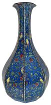 A ROYAL DOULTON HEXAGONAL VASE DECORATED WITH CANARIES ON A BLUE FLORAL GROUND, D4031, 37cm high **