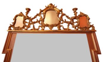 A PAIR OF GILT DECORATED DOOR MIRRORS of scrolled gilt carved decoration, 135x50cm **PLEASE NOTE: