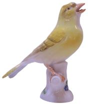 A MEISSEN YELLOW CANARY SAT UPON A TREE STUMP, 11cm high **PLEASE NOTE: THIS AUCTION IS IN HONG