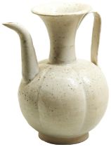 A QINGBAI EWER SONG DYNASTY OR LATER with a strap handle and a gently curved upright spout. The