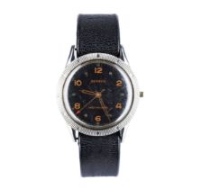 BENRUS. A STEEL WRISTWATCH black dial signed Benrus, Shock-Absorber, gilt hands, centre seconds,