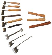 A GROUP OF NINE VINTAGE GUNPOWDER MEASURES, mostly French, six with turned wooden handles, three