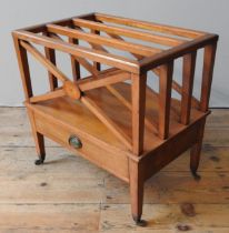 A LATE 19TH / EARLY 20TH CENTURY SATIN WOOD CANTERBURY, rectangular form with four X-frame