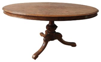 A WALNUT LOO TABLE, 19TH CENTURY, the tilting oval top raised on a baluster turned pedestal raised