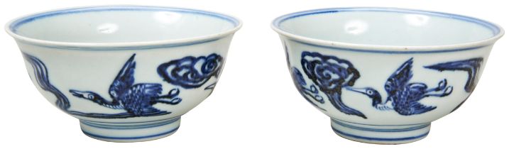 PAIR OF BLUE AND WHITE 'CRANES AND CLOUDS' BOWLS 20TH CENTURY each painted with cranes in flight