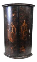 A LATE 18TH/EARLY 19TH CENTURY CHINOISERIE DECORATED CORNER CUPBOARD, the bow front doors painted