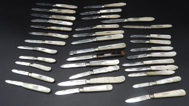 A LARGE COLLECTION OF THIRTY THREE VINTAGE SILVER BLADED POCKET KNIVES, all with mother of pearl