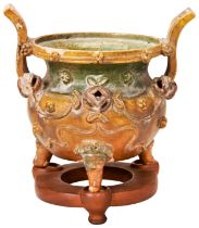 SANCAI-GLAZED TRIPOD CENSER MING DYNASTY the baluster sides decorated in high relief with masks