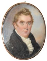 AN 18TH CENTURY PORTRAIT MINIATURE OF GENTLEMAN, in navy frock coat and frilled stock, hand