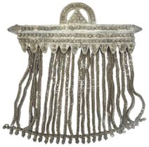 A VINTAGE BEDOUIN PENDANT, possibly Yemeni or Omani silver, comprised of a beaded bar suspended from