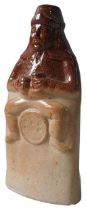 A SALT GLAZED FLASK, CIRCA 1840, modelled as 'Old Tom', holding a jug and