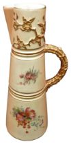 A ROYAL WORCESTER IVORY BLUSH JUG, CIRCA 1900, tapered sectional form with floral spray decoration