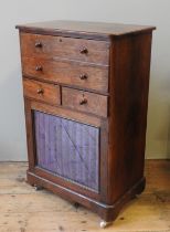 A LATE VICTORIAN WALNUT CABINET, with a pull out drop front secretaire section above two frieze
