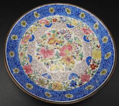 A FINE CHINESE ENAMEL DISH, 19TH CENTURY, the central lotus form reserve filled with a profusion