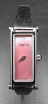 GUCCI STAINLESS STEEL WATCH, with inscribed pink oblong dial, in presentation box