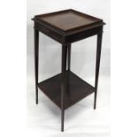 A LATE VICTORIAN MAHOGANY URN STAND, galleried square top with line inlay raise on four slender