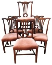 A SET OF SIX GEORGE III MAHOGANY DINING CHAIRS, CIRCA 1770, in the Chippendale manner, foliate