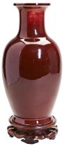 LARGE SANG-DE-BOEUF GLAZED VASE 20TH CENTURY covered in a deep rich crushed strawberry-red glaze