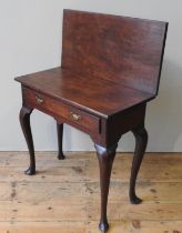 A 19TH CENTURY MAHOGANY TEA TABLE, fold over rectangular top over a single frieze drawer, raised