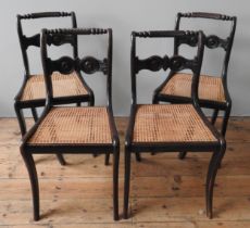 A SET OF FOUR 19TH CENTURY CANE SEAT MAHOGANHY CHAIRS, rope twist top rails above roundel carved