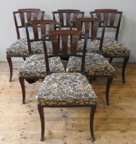 A SET OF SIX 19TH CENTURY MAHOGANY DINING CHAIRS, curved top rail over three fluted splats, the wide