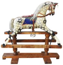 A VINTAGE HAND PAINTED CHILD'S NURSERY ROCKING HORSE, CIRCA 1920, with a cream and black dappled