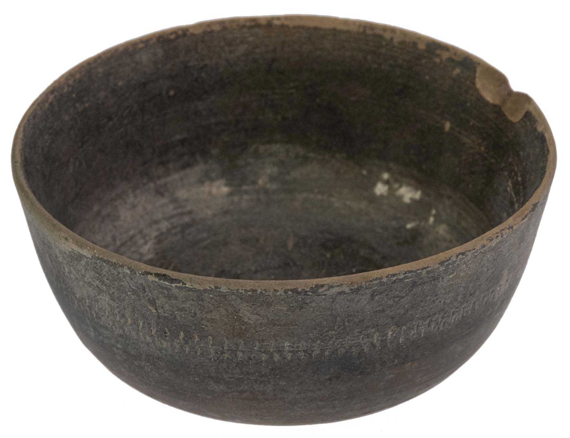 Small bowl from brown clay, glued breakage, small defect at the edge, height approximate 3 cm; diame