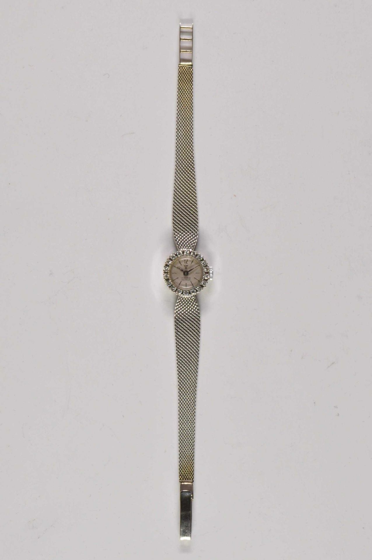 Brillant Damenuhr \Star\ 17 Rubis. Um 1930, Gehäuse 585er Weißgold, Armband 590rt Gold gestempelt. G - Bild 2 aus 3