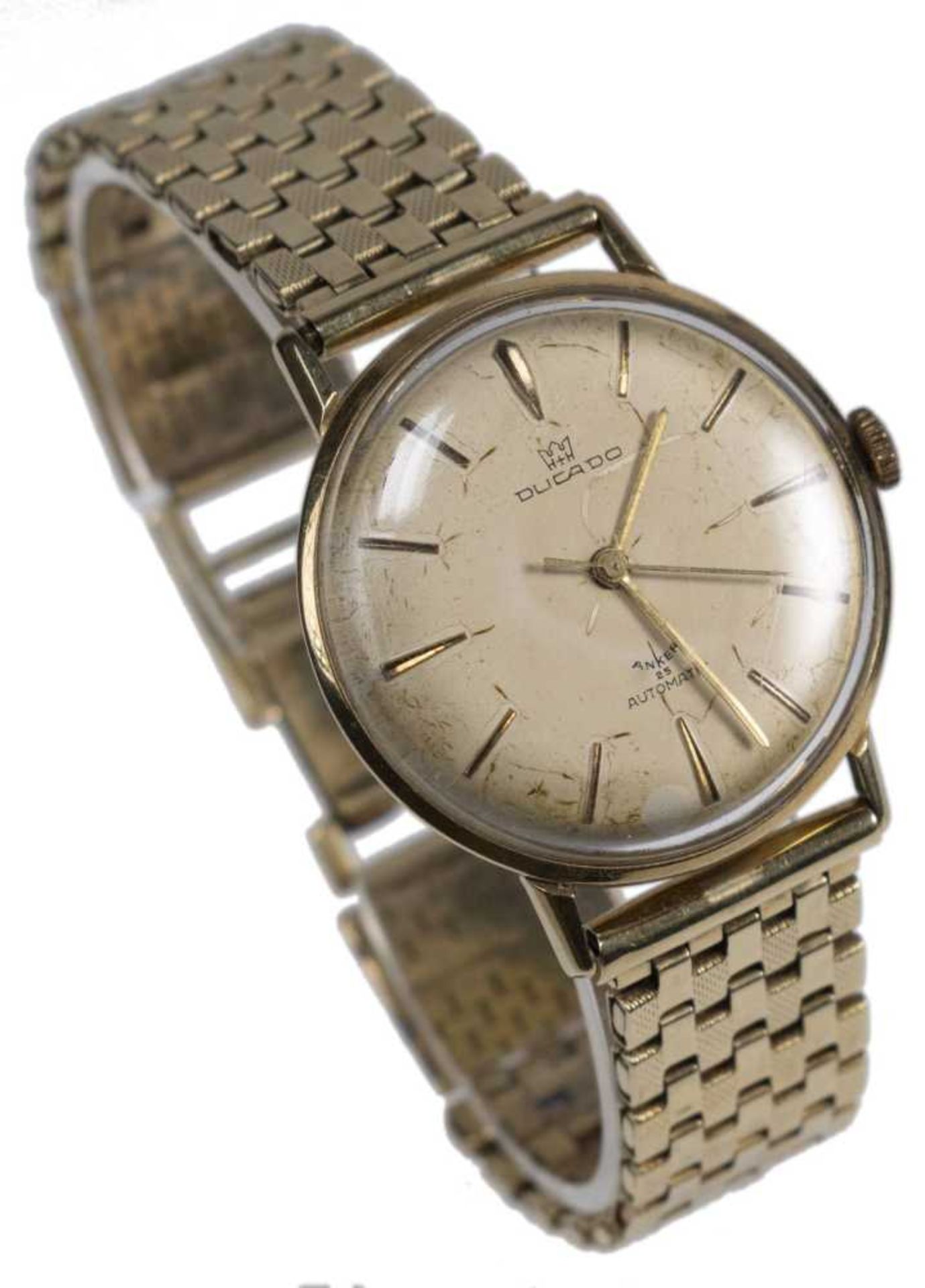 Ducado men's wristwatch. Ca. 34 mm, 585er yellow gold, automatic. Champagne-coloured dial with golde