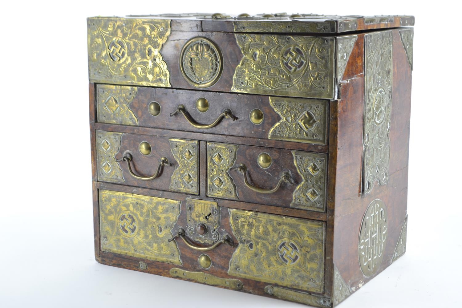 Small Asian four drawer cabinet with ornate pressed brass banding and lift up top H30cm W35.5 D23.5c