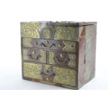 Small Asian four drawer cabinet with ornate pressed brass banding and lift up top H30cm W35.5 D23.5c