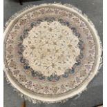 Finely woven Irani circular rug in shades of cream, blush and pale blue, diameter 2.5m