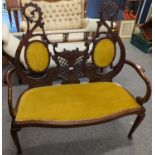 Art Nouveau style salon / lounge sofa in very ornate mahogany with gold coloured upholstery.
