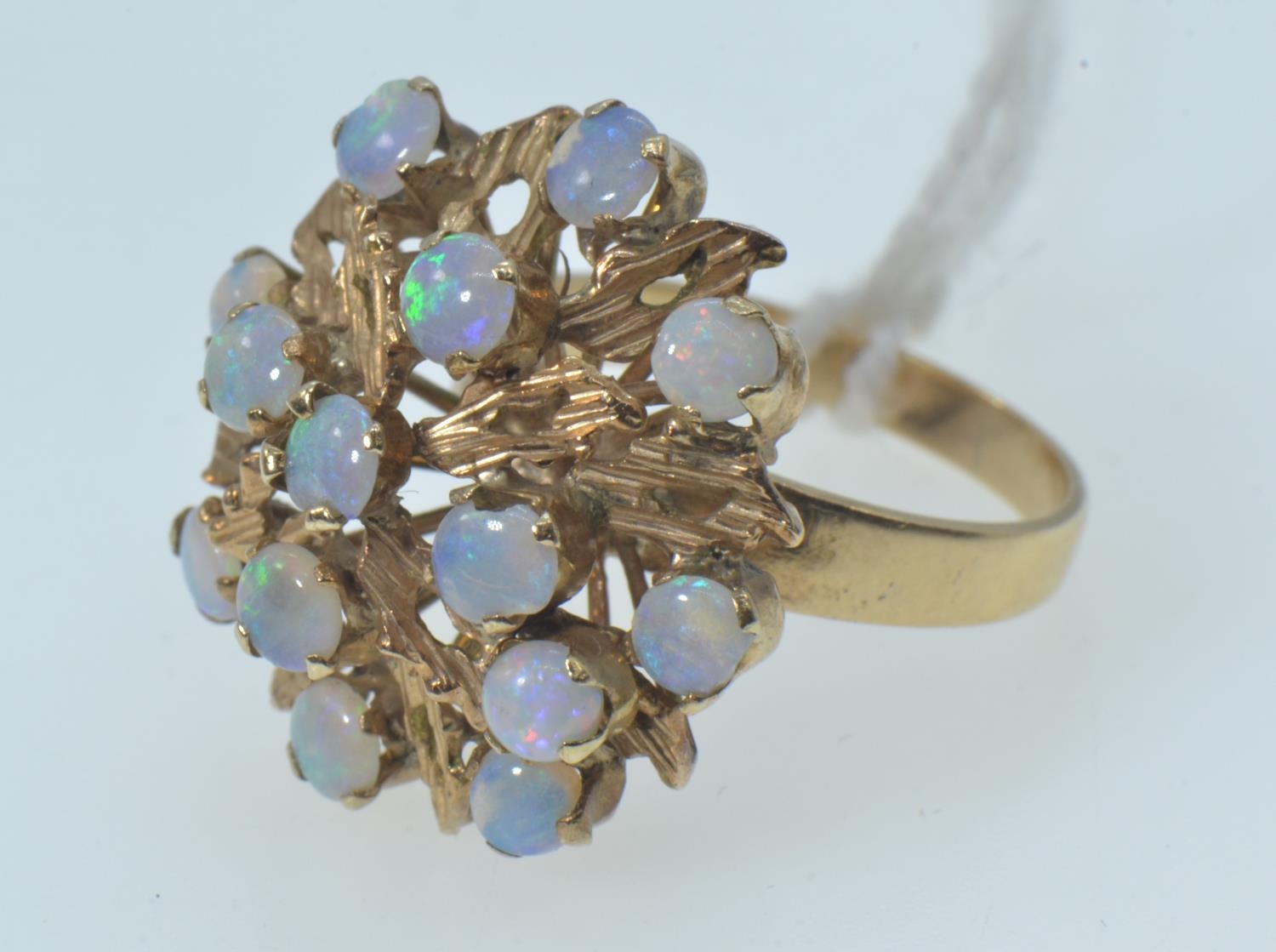 Opal cluster ring, the yellow metal mount testing positive for 9ct gold, with 14 opals of good colou - Image 5 of 6