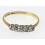 18ct gold ring set with five diamonds on a platinum mount, size M1/2, gross weight 1.9 grams