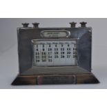 Silver & ebonised wood desk top perpetual calendar, W J Myatt & Co, Birmingham 1932, the base with a