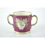 1937 Coronation: a loving cup by Adderley Ware, the dark red ground well decorated in colours and gi