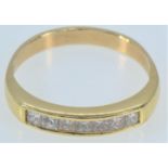 Yellow metal & channel-set diamond half hoop ring, tests positive for 18ct gold, size Q1/2, gross we