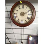 Mahogany cased Victorian postman wall clock with brass hands and numbered centre face, D30cm