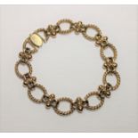 9ct gold fancy linked bracelet, circumference 200mm, gross weight 26.21 grams