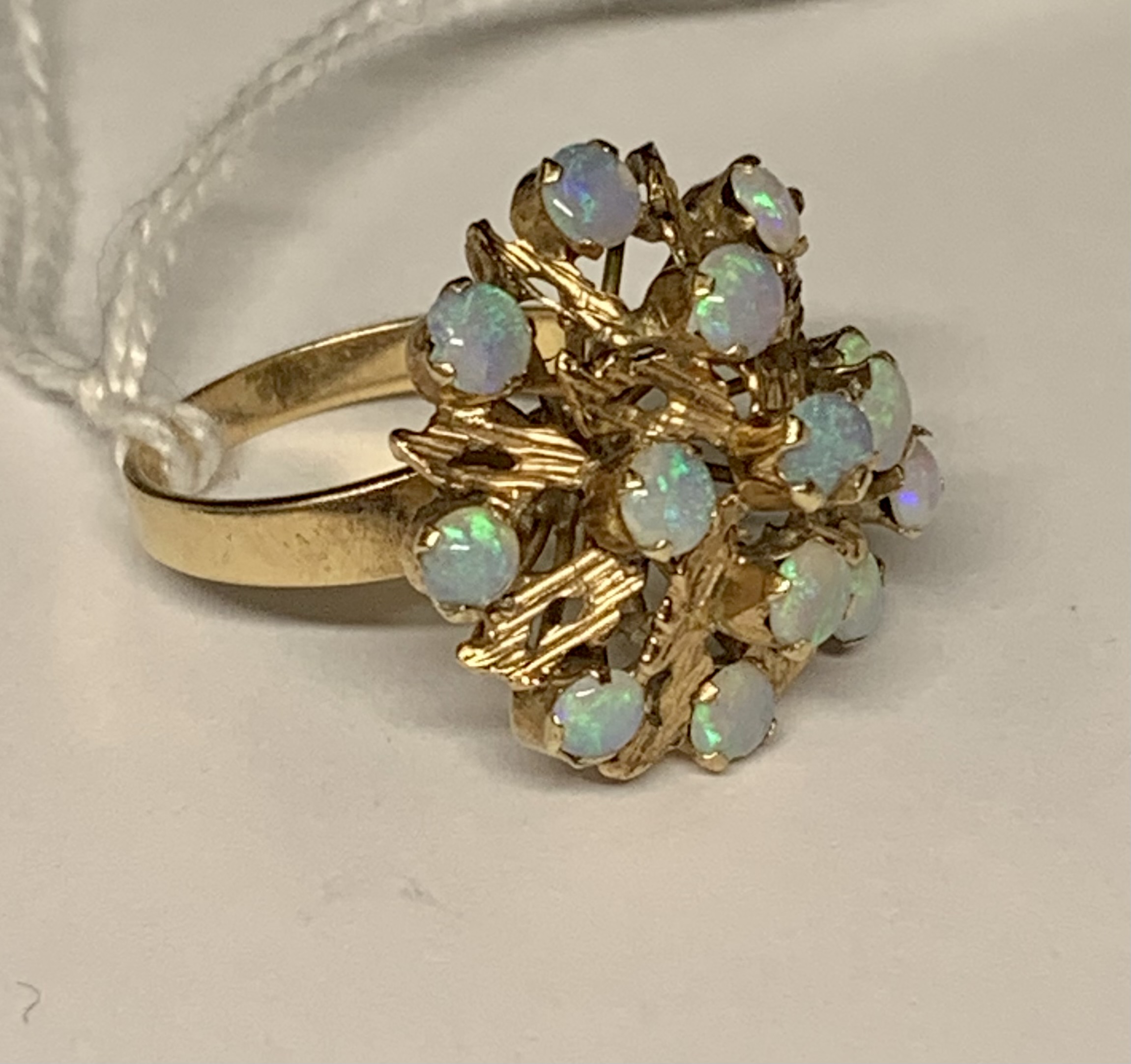 Opal cluster ring, the yellow metal mount testing positive for 9ct gold, with 14 opals of good colou - Image 2 of 6