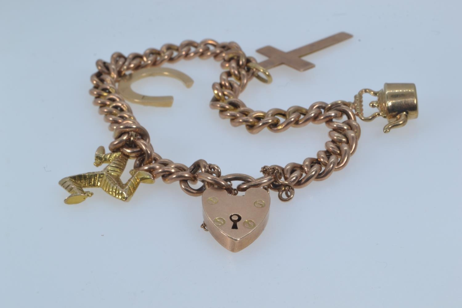 9ct rose gold bracelet with a heart-shaped padlock clasp, suspending four charms, including three 9c - Image 2 of 6