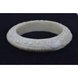 Hardstone bangle, possibly white jade, beautifully carved detail around circumference of the bangle,