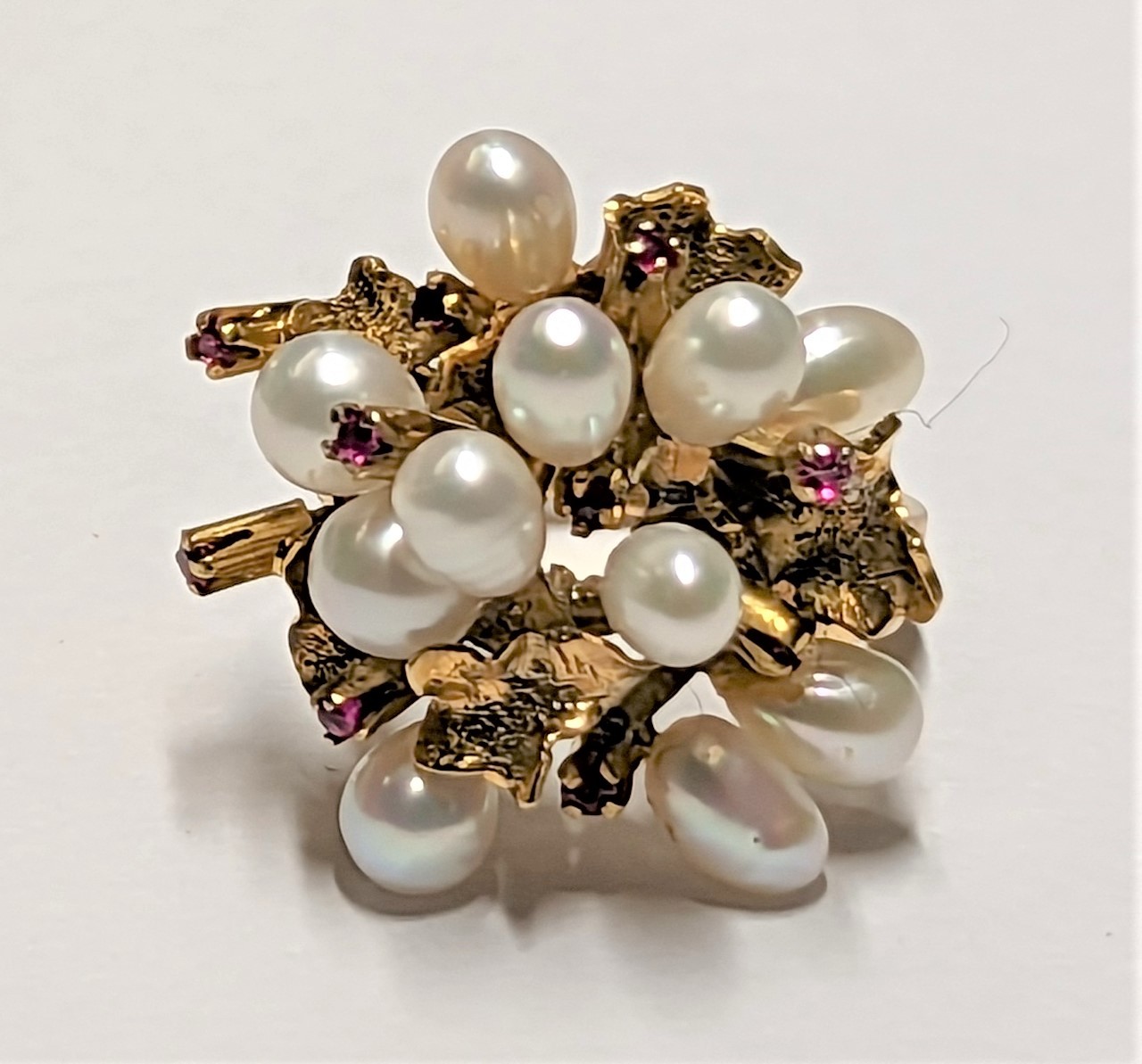 14ct gold cluster ring set with eleven pearls and ten rubies, marked 14K, size L, gross weight 7 gra