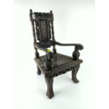 Victorian ornately carved apprentice chair, with woven seat and back in the style of an early elbow