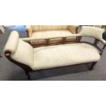 Regency style sofa /chaise with ornate carved wood surround and legs with original castors. W 180 D