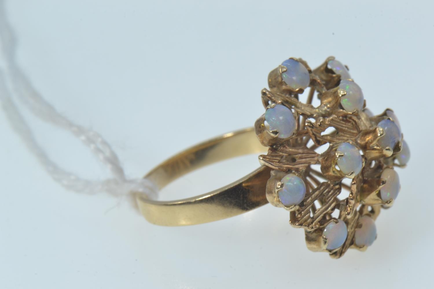 Opal cluster ring, the yellow metal mount testing positive for 9ct gold, with 14 opals of good colou - Image 4 of 6