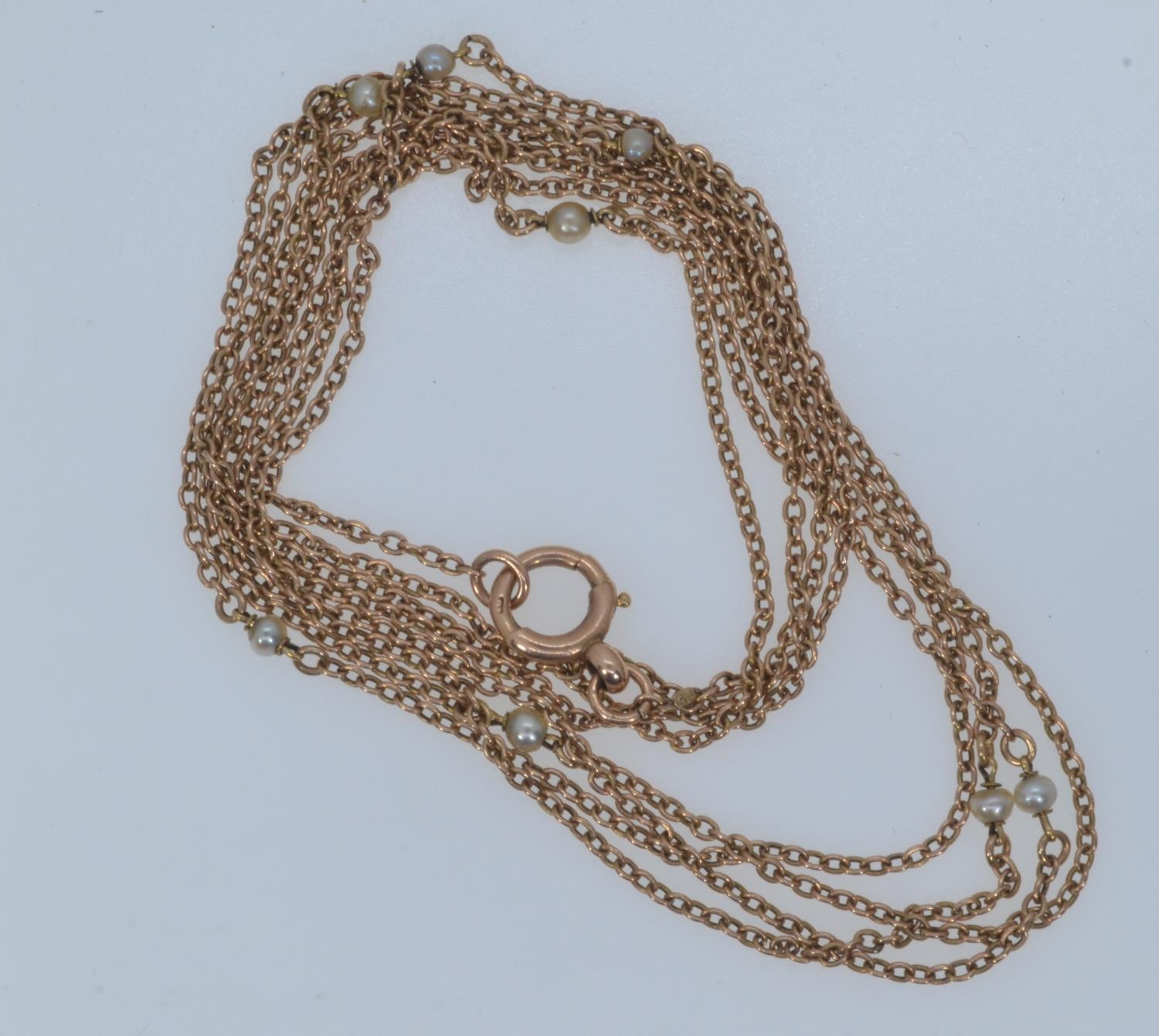 15ct rose gold & seed pearl long chain, circumference 1560mm, gross weight 16.69 grams 
